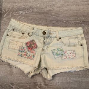 Patched jean shorts